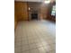 Living room with brick fireplace and wood paneling at 4193 Dunmore Rd, Decatur, GA 30034