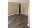Spacious living room with hardwood floors and access to other rooms at 4193 Dunmore Rd, Decatur, GA 30034