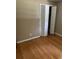 Bedroom with hardwood floors and bifold closet doors at 4193 Dunmore Rd, Decatur, GA 30034