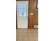 White front door with glass panes and wood paneling at 4193 Dunmore Rd, Decatur, GA 30034