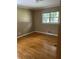 Bedroom with hardwood floors and a window at 4193 Dunmore Rd, Decatur, GA 30034