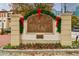 Tuscan Condominiums entrance sign with festive holiday decor at 955 Juniper Ne St # 4027, Atlanta, GA 30309