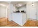 Well-equipped kitchen with white cabinets and a breakfast bar at 955 Juniper Ne St # 4027, Atlanta, GA 30309