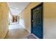 Building hallway with teal doors and neutral walls at 955 Juniper Ne St # 4027, Atlanta, GA 30309