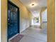 Building hallway with teal doors and neutral walls at 955 Juniper Ne St # 4027, Atlanta, GA 30309