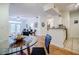 Bright dining area with hardwood floors, a glass-top table and kitchen views at 955 Juniper Ne St # 4027, Atlanta, GA 30309