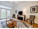 Bright living room with hardwood floors, comfy seating, and access to a private patio at 955 Juniper Ne St # 4027, Atlanta, GA 30309