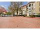 Attractive brick-paved entrance to an apartment building with autumn trees at 955 Juniper Ne St # 4027, Atlanta, GA 30309