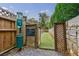 Well-maintained dog park with artificial turf and pet waste station at 955 Juniper Ne St # 4027, Atlanta, GA 30309