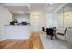 Open concept kitchen with white cabinets and hardwood floors at 955 Juniper Ne St # 4027, Atlanta, GA 30309
