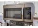 Stainless steel microwave above the stovetop at 955 Juniper Ne St # 4027, Atlanta, GA 30309