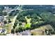 Aerial view of property near houses and a road at 3525 Hamilton Mill Rd, Buford, GA 30519