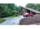 Rustic home with a red truck parked in the driveway at 3525 Hamilton Mill Rd, Buford, GA 30519