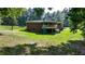 Brick house with a deck and expansive backyard, partially wooded lot at 3525 Hamilton Mill Rd, Buford, GA 30519