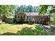 Back of house with deck and large backyard at 3525 Hamilton Mill Rd, Buford, GA 30519
