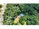 Aerial view showing home, pool, and surrounding landscape at 3525 Hamilton Mill Rd, Buford, GA 30519