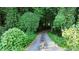 Long driveway through lush foliage leading to a home at 3525 Hamilton Mill Rd, Buford, GA 30519