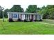 Gray house with red door and sunroom at 3525 Hamilton Mill Rd, Buford, GA 30519