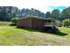 Brick home with a deck and large backyard at 3525 Hamilton Mill Rd, Buford, GA 30519