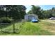 Detached garage with a sports car parked in front at 3525 Hamilton Mill Rd, Buford, GA 30519