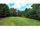 Aerial view of property showing a large yard and outbuildings at 3525 Hamilton Mill Rd, Buford, GA 30519