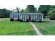 Gray house with red door and sunroom at 3525 Hamilton Mill Rd, Buford, GA 30519