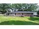 Ranch style home with a large deck and spacious backyard at 3525 Hamilton Mill Rd, Buford, GA 30519