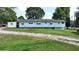 White house with large yard and shed at 3525 Hamilton Mill Rd, Buford, GA 30519