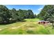 Aerial view of property showing a large yard and outbuildings at 3525 Hamilton Mill Rd, Buford, GA 30519