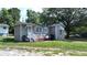 Gray cottage with a small front porch and side view, surrounded by a grassy yard at 3525 Hamilton Mill Rd, Buford, GA 30519