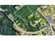 Aerial lot view showing property lines, several houses, and surrounding trees at 3525 Hamilton Mill Rd, Buford, GA 30519
