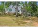 Back exterior view of a two-story house with a large backyard at 5622 Williamsburg Dr, Norcross, GA 30093