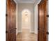 Charming hallway with arched entryway and hardwood floors at 1608 Golden Creek Sw Ct, Conyers, GA 30094