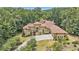Luxury home with a large driveway and landscaped yard at 1608 Golden Creek Sw Ct, Conyers, GA 30094