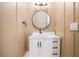 Modern powder room with a round mirror and white vanity at 1608 Golden Creek Sw Ct, Conyers, GA 30094