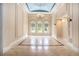 Elegant dining room with arched windows, tray ceiling, and marble flooring at 1608 Golden Creek Sw Ct, Conyers, GA 30094