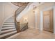 Impressive curved staircase with ornate railing and wooden steps at 1608 Golden Creek Sw Ct, Conyers, GA 30094