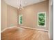 Large bedroom with hardwood floors and two windows at 1608 Golden Creek Sw Ct, Conyers, GA 30094