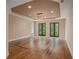 Main bedroom with hardwood floors and French doors at 1608 Golden Creek Sw Ct, Conyers, GA 30094