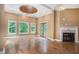 Sunlit living room with hardwood floors, fireplace and French doors at 1608 Golden Creek Sw Ct, Conyers, GA 30094