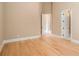 Spacious bedroom with hardwood floors and access to a bathroom at 1608 Golden Creek Sw Ct, Conyers, GA 30094