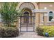 Ornate wrought-iron gate leading to the grand entrance of the house at 1608 Golden Creek Sw Ct, Conyers, GA 30094
