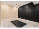 Finished recreation room with a statement wall and prepped flooring at 1608 Golden Creek Sw Ct, Conyers, GA 30094
