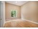 Bright bedroom with hardwood floors and large windows at 1608 Golden Creek Sw Ct, Conyers, GA 30094