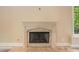 Ornate fireplace with detailed mantel and tile surround at 1608 Golden Creek Sw Ct, Conyers, GA 30094