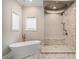 Luxurious bathroom with a soaking tub and a walk-in shower at 1608 Golden Creek Sw Ct, Conyers, GA 30094