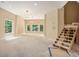 Unfinished basement with large windows and exposed stairs at 1608 Golden Creek Sw Ct, Conyers, GA 30094