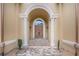 Elegant double front doors with stone steps and ornate columns at 1608 Golden Creek Sw Ct, Conyers, GA 30094