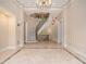 Stunning entryway showcasing a grand, curved staircase at 1608 Golden Creek Sw Ct, Conyers, GA 30094