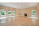 Spacious great room featuring a fireplace and large windows at 1608 Golden Creek Sw Ct, Conyers, GA 30094